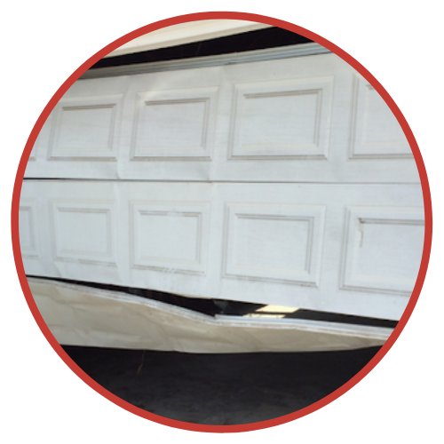 Damaged Commercial Garage Doors - Repairs Done by The Door Master