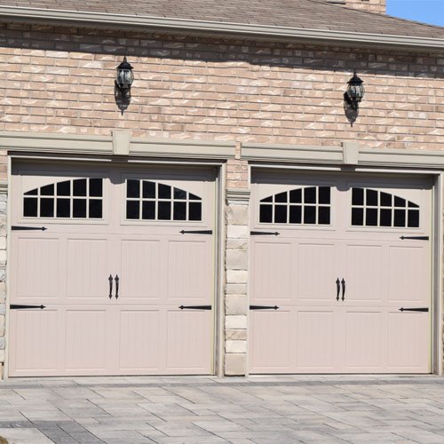 The Door Master- Two beige garage doors with windows