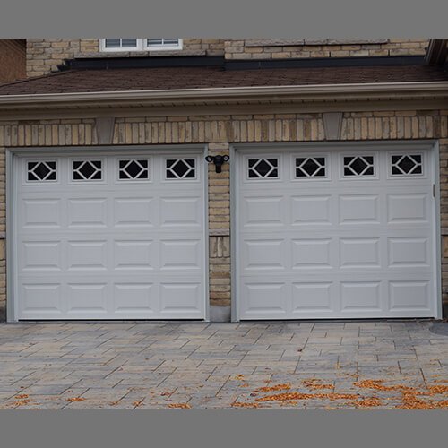 The Door Master. 2 garage doors Traditional Raised Panel