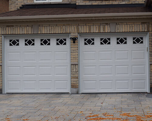 The Door Master. 2 garage doors Traditional Raised Panel